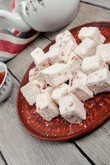 Turkish delight on a wooden table.