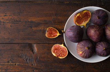 Ripe figs on old wooden table