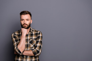 Young handsome brunet isolated on gray background with copy spac