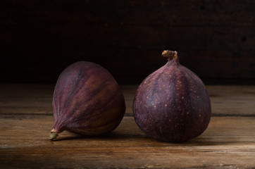 Ripe figs on old wooden table