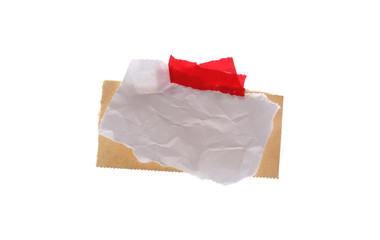 Crumpled paper, cardboard with red tape isolated on white background, clipping path