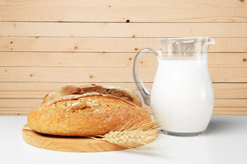 Bread and milk on the table