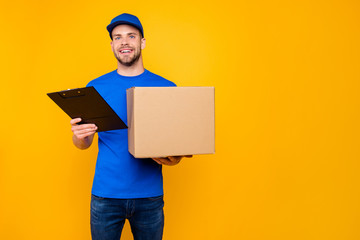Portrait of handsome attractive cheerful bearded mailman, postma