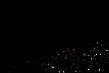 Black bokeh texture on black