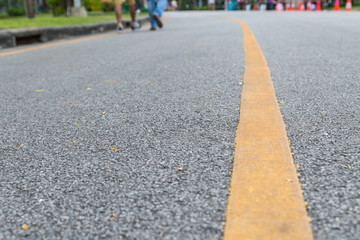 Fototapeta premium Close up of yellow line on the public park