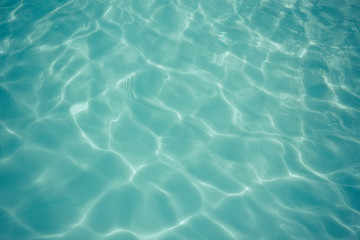 Fototapeta na wymiar light blue water texture pattern in swimming pool