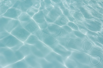 light blue water  texture pattern in swimming pool