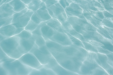 light blue water  texture pattern in swimming pool