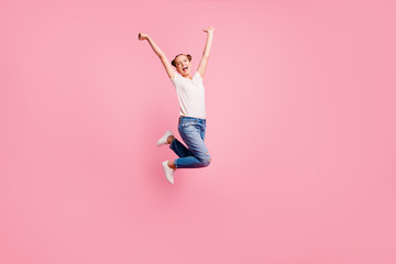 Full length size body studio photo portrait of cheerful glad rejoicing pretty nice charming cute lovely sweet girl jumping up isolated on pastel pink background