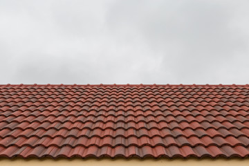 Roof tile pattern over sky background