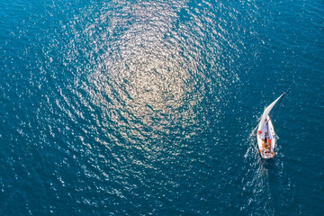 Top view of a sailing yacht in the sea