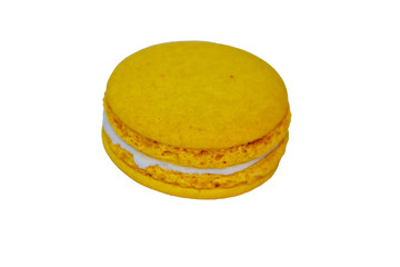 Tasty yellow macaroon isolated on white background