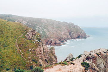 Coast of Portugal, Cape Cabo da Roca - the westernmost point of Europe. Ocean waves  - 221087650