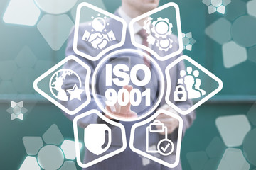 Businessman clicks a iso 9001 text button on a virtual panel. Quality Management System Control. Certification Business Requirements Quality Reliability Service Standards. ISO9001.