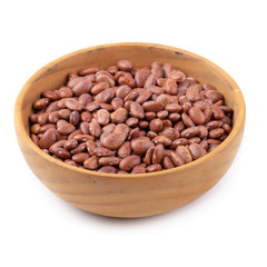 pinto beans in a wooden bowl isolated on a white background