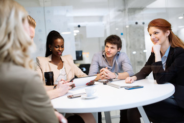 Group of business people sitting at desk