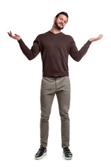 A bearded man in casual clothes stands with both arms up and a questioning face expression.