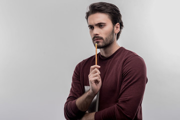 Bearded economist. Image without face retouching with bearded economist feeling very thoughtful planning new project