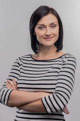 Promising psychologist. Image without face retouching with young promising psychologist standing in...