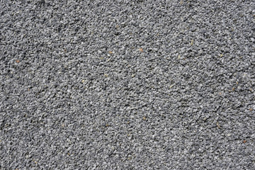 Surface de petits cailloux gris