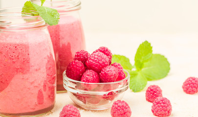 Raspberry smoothie close up photography with fresh summer blended cocktail and ripe berries.