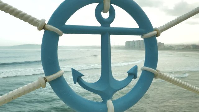 Sailor sign of anchor made of iron at sea beackground