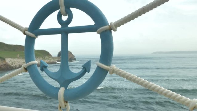 Sailor sign of anchor made of iron at sea beackground