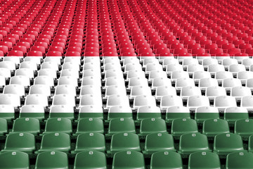 Fototapeta premium Siedziska stadionowe z flagą Węgier. Koncepcja konkurencji sportowych.