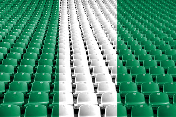 Obraz premium Nigeria flag stadium seats. Sports competition concept.