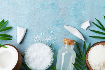 Natural coconut products for spa, cosmetic or food ingredients. Oil, water and shavings on blue...