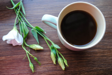 Cup of coffee and flowers