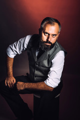 Very charismatic looking bearded man portrait in studio