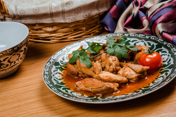 Traditional Uzbek oriental cuisine. Uzbek family table from different dishes for the New Year holiday. The background image is a top view.