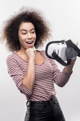Surprised woman. Image without face retouching with surprised woman feeling extremely excited...