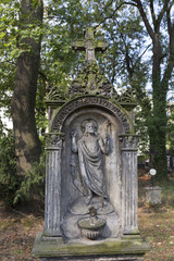 Historic Statue on the mystery old Prague Cemetery, Czech Republic