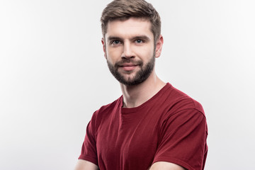 Handsome man. Image without face retouching with bearded dark-haired handsome man wearing dark red...