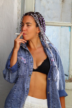 brunette woman with pigtails Smoking a cigarette