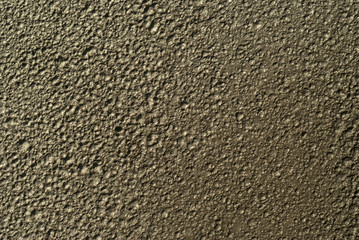 background, texture - the lunar surface, top view (in fact - wet clay with traces of rain drops)