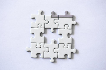 Obraz premium Piece of a puzzle missing on a white background