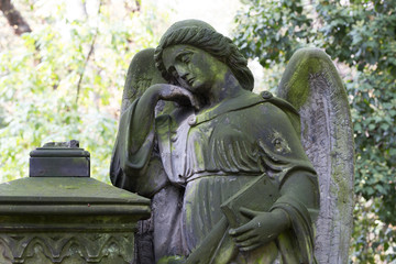 Obraz premium Historic Statue on the mystery old Prague Cemetery, Czech Republic