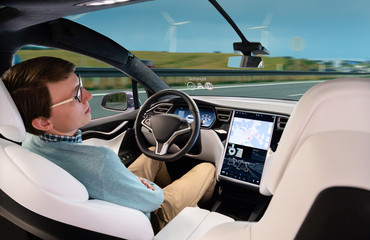 A man sleeps while his car is driven by an autopilot. Self driving vehicle concept