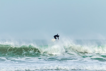 Wave jumping, Fistral beach, Newquay, Cornwall