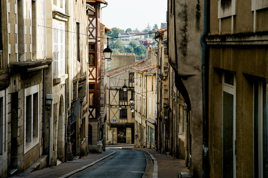 Fototapeta Poitiers, France - 7 August 2018: half-timbered houses at old french town street