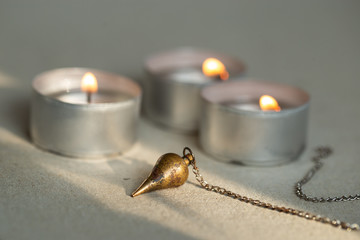 Isolated pendulum and candle lights