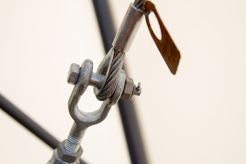 Hinged swivel joint of the hinge with steel cable. On the steel cable - the tag with the data of...