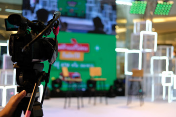 video production camera recording live event on stage. television social media broadcasting seminar...