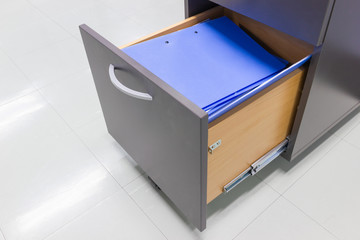 blue file folder documents In a file cabinet retention of contracts, Documentation Concepts