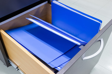 blue file folder documents In a file cabinet retention of contracts, Documentation Concepts