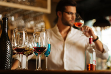 Big choice. Selective focus of glasses with different types of wine standing on the bar counter