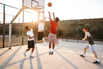 Rolgordijnen Group of young sporty multiethnic men basketball players © Drobot Dean